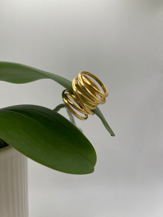 Contemporary gold spiral ring for minimalists, elegant and lightweight design.