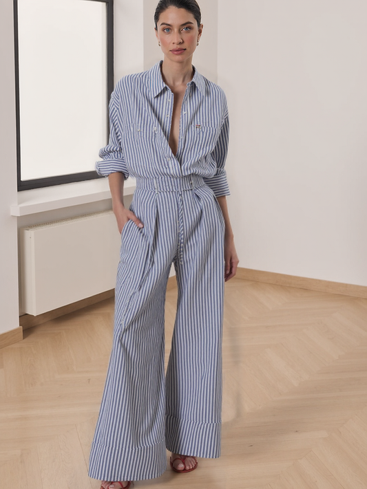 Woman wearing blue and white striped wide-leg pants with a high waist and relaxed fit
